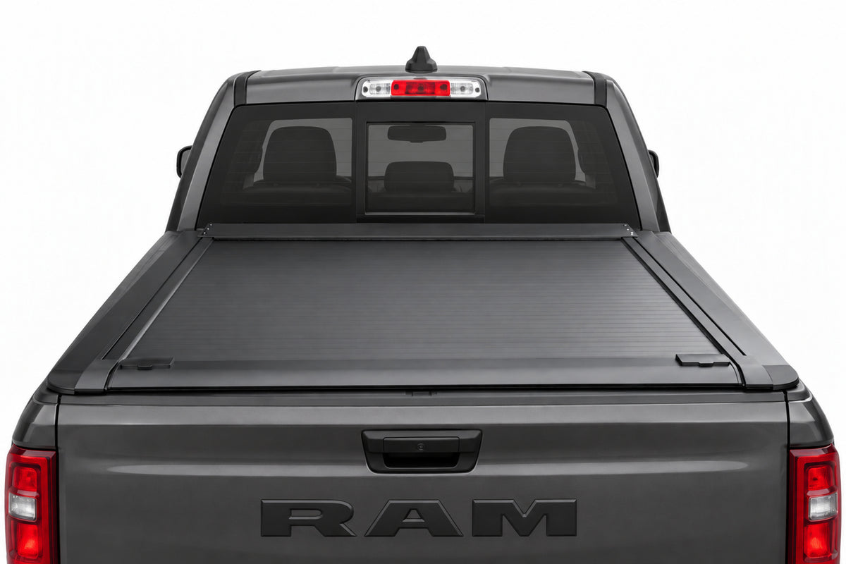 Retractable cover fully retracted into its canister — open truck bed