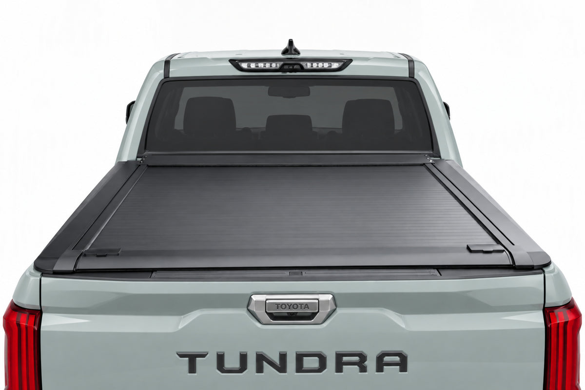 Retractable cover fully retracted into its canister — open truck bed