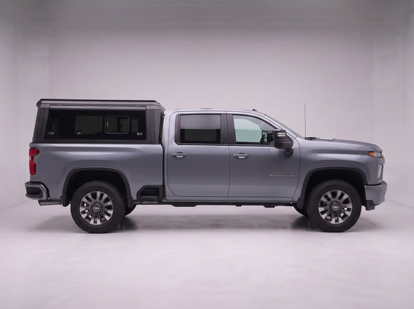 Side profile of the truck cap on a Chevrolet Silverado 2500/3500, following the cab lines