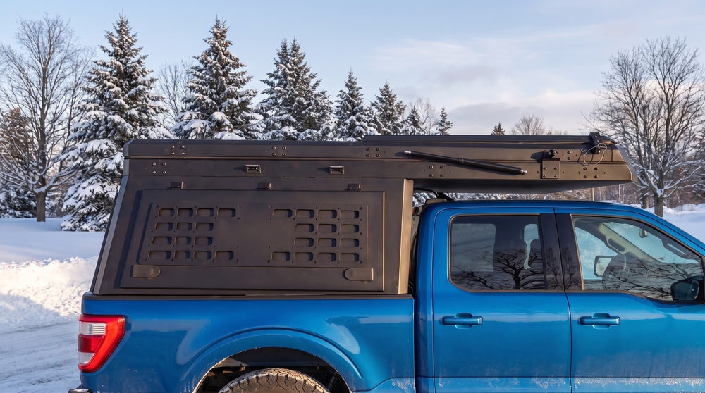 Ford F-150 truck cap camper closed up for winter driving on a snowy Ontario road