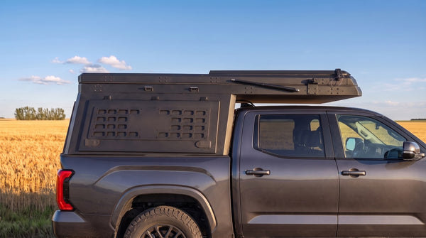 Locking side MOLLE panel on the aluminium truck cap camper