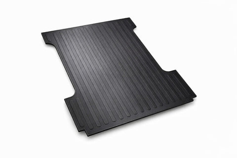 Heavy-duty rubber truck bed mat used together with a tonneau cover