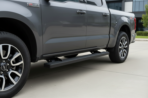 Running boards installed on a pickup truck