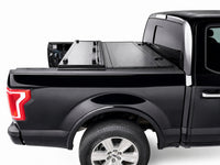 Flip-back cover folded toward the cab for full truck bed access — view 11