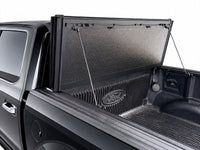 Propped-open front panel showing gas struts and bed access — view 16