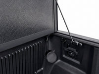 Latch mechanism, drain tube and prop rod detail inside the bed — view 17