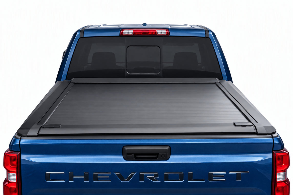 Retractable cover fully retracted into its canister — open truck bed