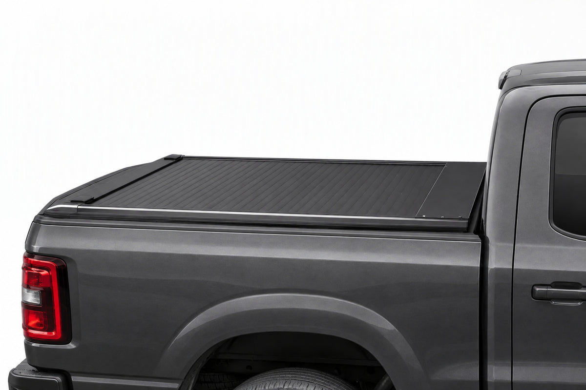 TruckTon manual retractable tonneau cover closed — low-profile matte black slats
