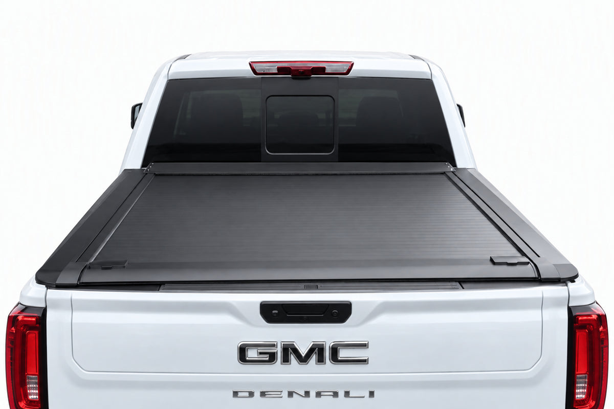 Retractable cover fully retracted into its canister — open truck bed