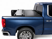 Flip-back cover folded toward the cab for full bed access — Chevy Silverado — view 11