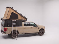 Step 2, main roof up: the roof tent open with the second hatch still closed, on a Chevy Colorado