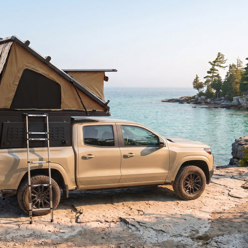 Chevy Colorado Double Pop-Up truck cap camper with the roof tent open on the Georgian Bay shoreline in Ontario