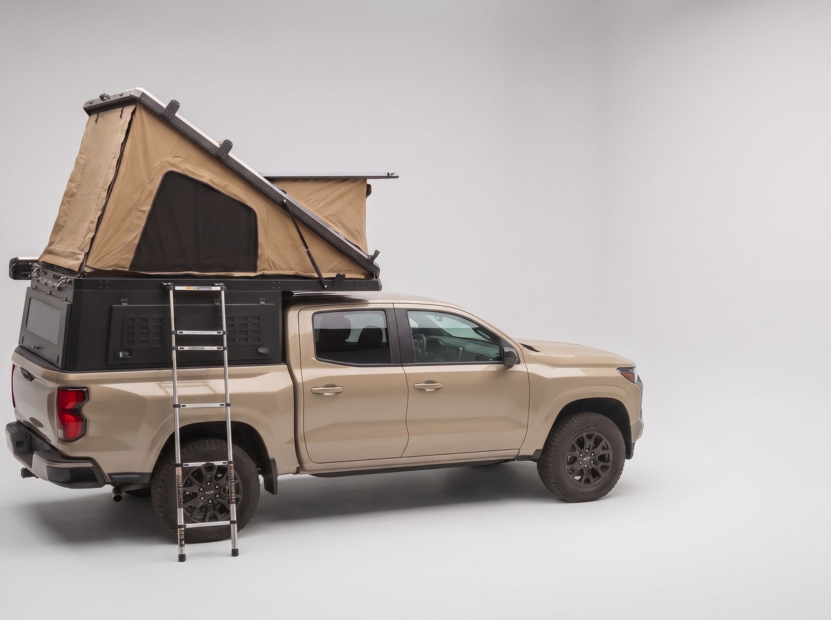 Studio side view of the Double Pop-Up truck cap camper on a Chevy Colorado