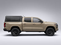 Side profile of a Chevy Colorado fitted with the TruckTon aluminum truck cap with tinted windows