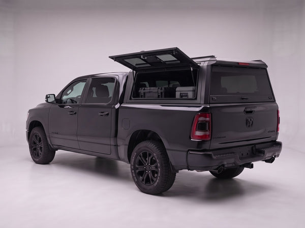 Lift-up tinted side window on the Dodge Ram 1500 aluminum truck cap