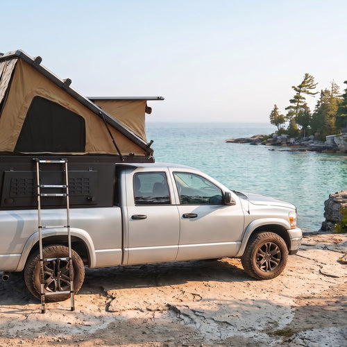 Dodge Ram 2500/3500 Double Pop-Up truck cap camper with the roof tent open on the Georgian Bay shoreline in Ontario