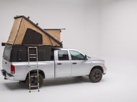 Studio side view of the Double Pop-Up truck cap camper on a Dodge Ram 2500/3500