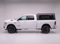 Side profile of a Dodge Ram 2500 3500 fitted with the TruckTon aluminum truck cap with tinted windows