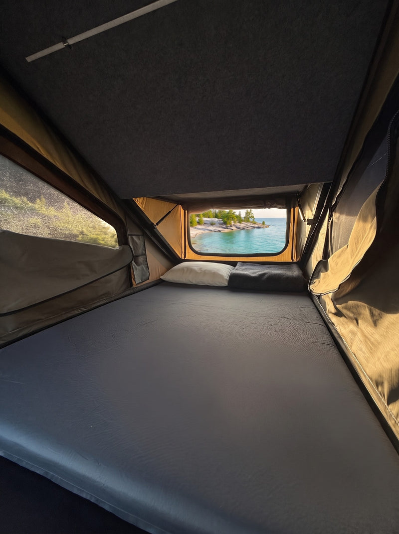 Memory foam mattress inside the Double Pop-Up roof tent, 50 by 100 inch sleeping area