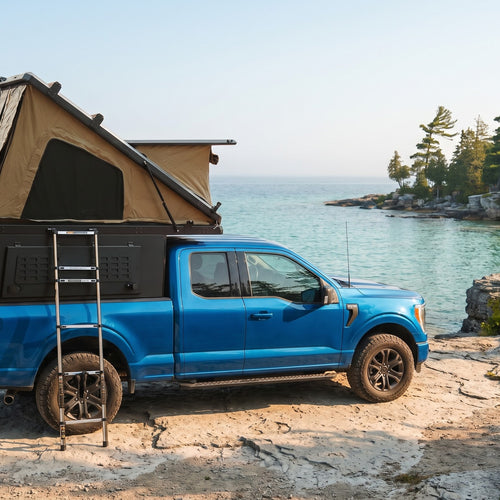 Ford F-150 Double Pop-Up truck cap camper with the roof tent open on the Georgian Bay shoreline in Ontario