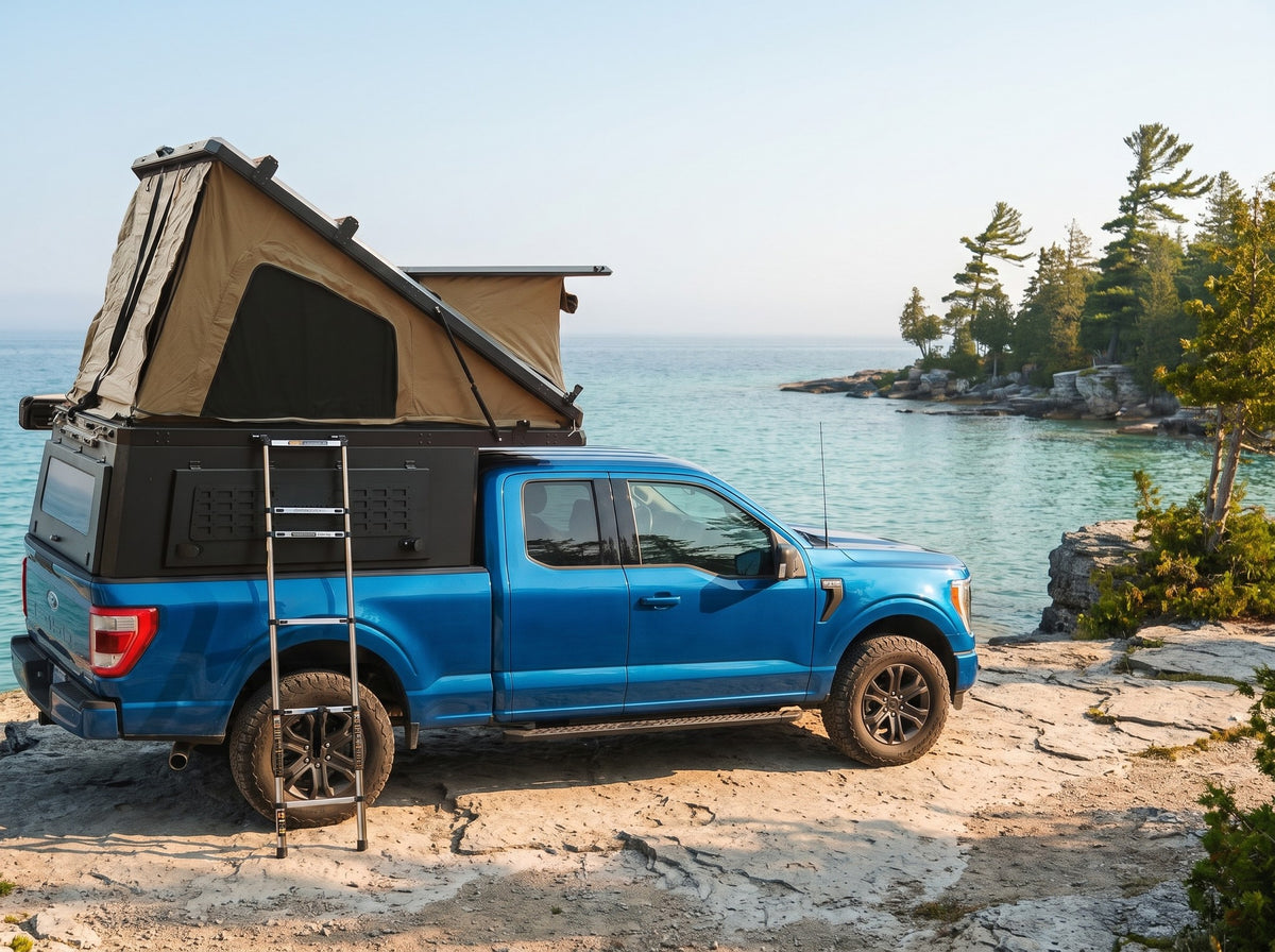 Ford F-150 Double Pop-Up truck cap camper with the roof tent open on the Georgian Bay shoreline in Ontario