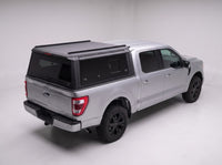 Elevated view of the Ford F-150 truck cap showing the flat roof and the rails along each side