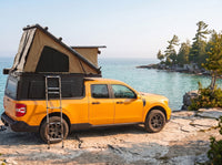 Ford Maverick Double Pop-Up truck cap camper with the roof tent open on the Georgian Bay shoreline in Ontario