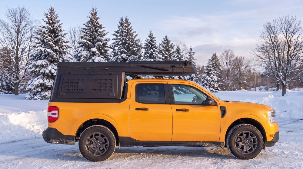 Ford Maverick truck cap camper closed up for winter driving on a snowy Ontario road