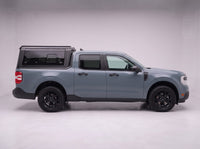Side profile of a Ford Maverick fitted with the TruckTon aluminum truck cap with tinted windows