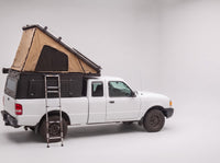 Step 2, main roof up: the roof tent open with the second hatch still closed, on a Ford Ranger
