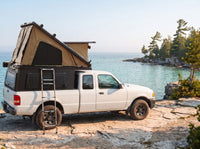 Ford Ranger Double Pop-Up truck cap camper with the roof tent open on the Georgian Bay shoreline in Ontario