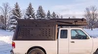 Ford Ranger truck cap camper closed up for winter driving on a snowy Ontario road
