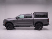 Side profile of a Ford Ranger fitted with the TruckTon aluminum truck cap with tinted windows