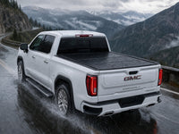 Sealed flip-back cover in heavy rain — GMC Sierra — view 18