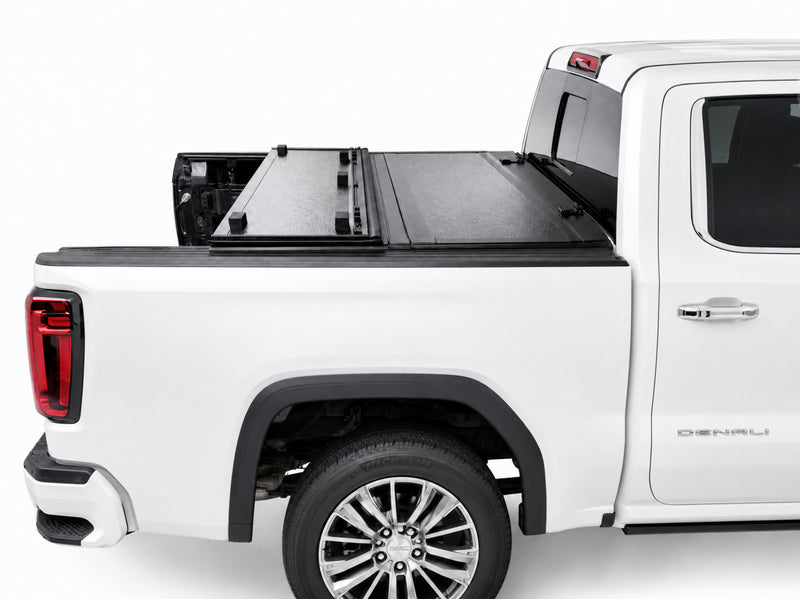 Cover folded toward the cab for flexible bed access
