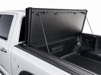 Propped-open panel showing gas struts and bed access — GMC Sierra — view 16