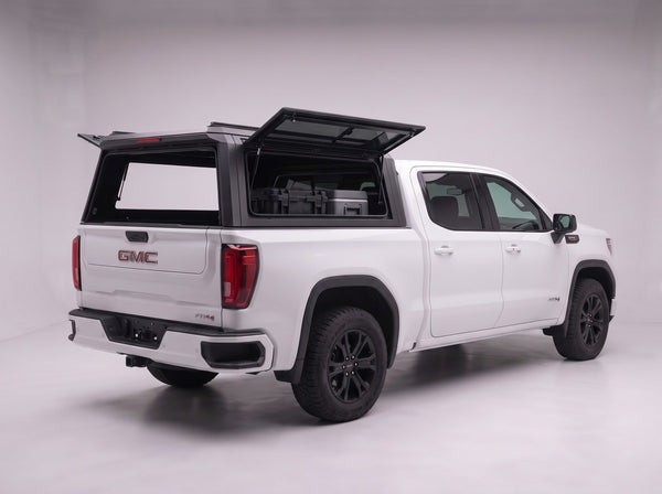 Lift-up tinted side window on the GMC Sierra 1500 aluminum truck cap