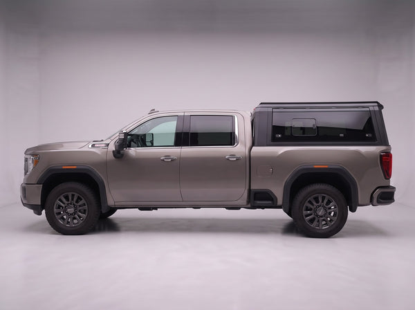 Side profile of the truck cap on a GMC Sierra 2500/3500, following the cab lines