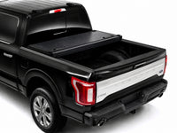 Cover folded open showing the truck bed — view 10