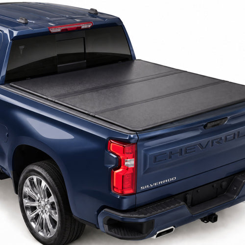 TruckTon low-profile hard tri-fold tonneau cover closed on a Chevy