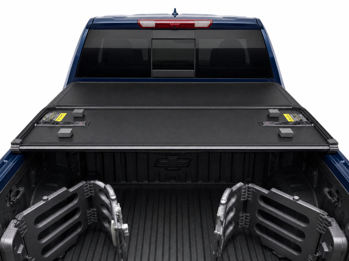 Folded cover viewed from inside the truck bed — clamp-on rails