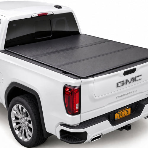 TruckTon low-profile hard tri-fold tonneau cover closed on a GMC Sierra