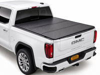 TruckTon low-profile hard tri-fold tonneau cover closed on a GMC Sierra — view 1