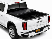 Cover folded open showing the truck bed — view 10