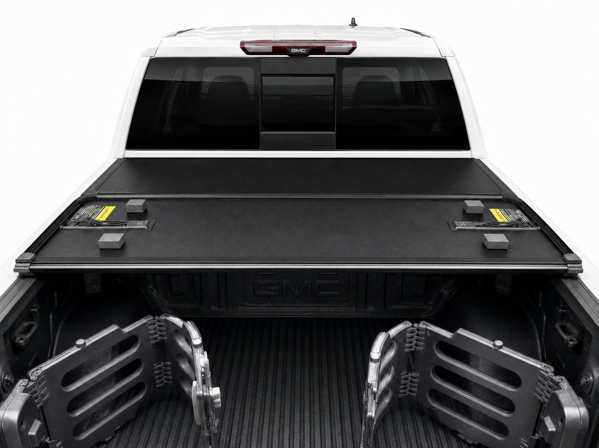 Folded cover viewed from inside the truck bed — clamp-on rails