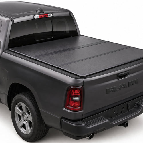 TruckTon low-profile hard tri-fold tonneau cover closed on a RAM