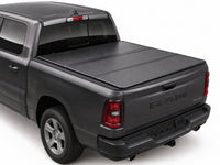 TruckTon low-profile hard tri-fold tonneau cover closed on a RAM — view 1
