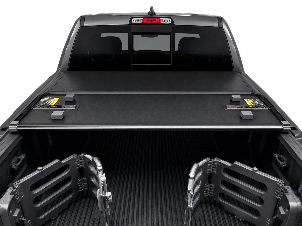Folded cover viewed from inside the truck bed — clamp-on rails