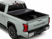 Cover folded open showing the truck bed — view 10