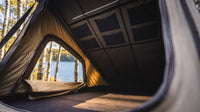 Memory foam mattress inside the Single Pop-Up roof tent with zip door open